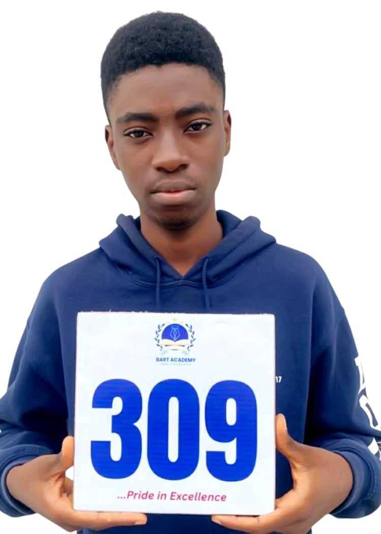 BART ACADEMY student holding a JAMB score card of 309