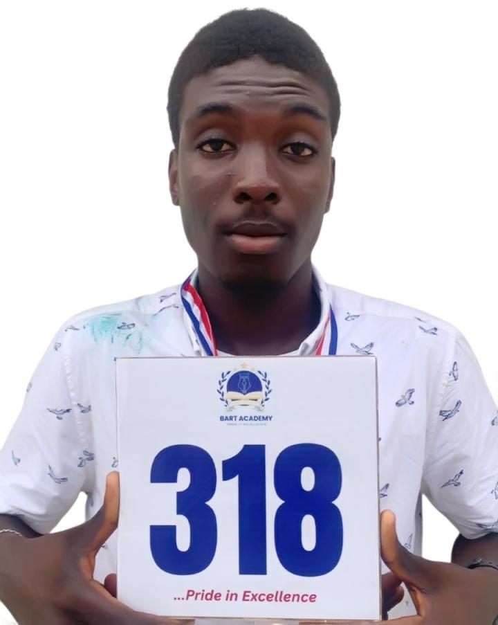 BART ACADEMY student holding a JAMB score card of 318