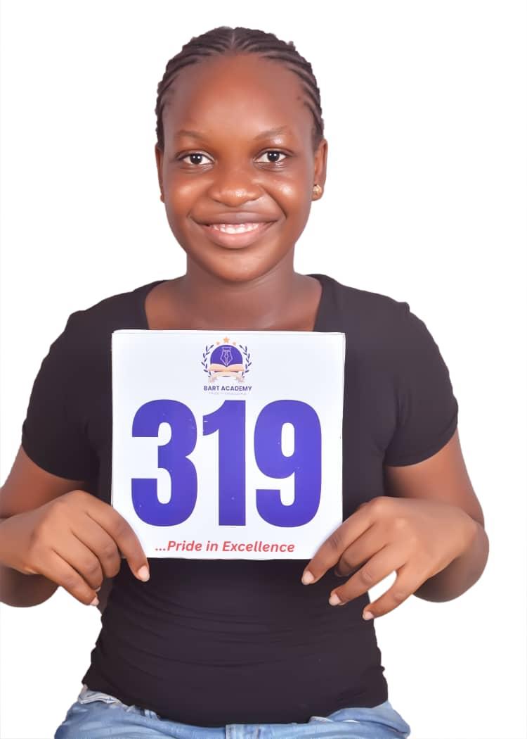 BART ACADEMY student holding a JAMB score card of 319