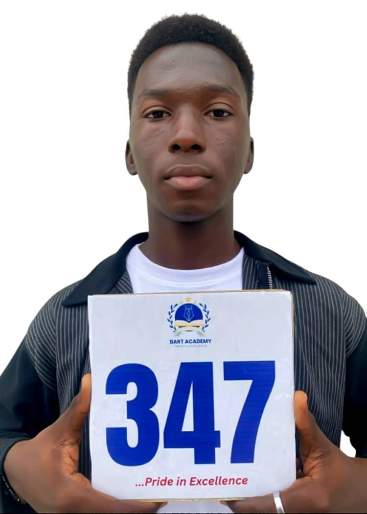 BART ACADEMY student holding a JAMB score card of 347